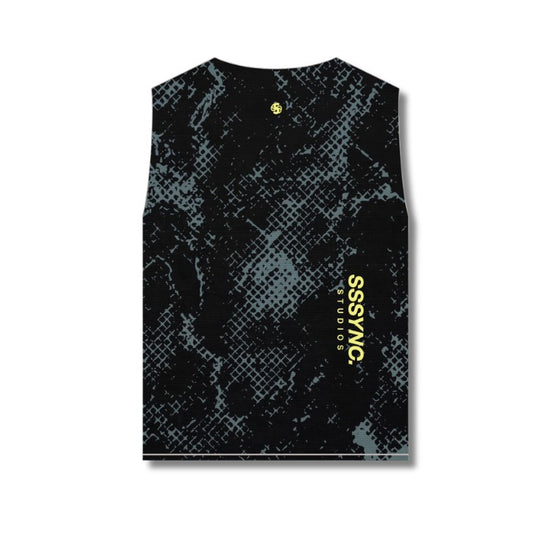 A sleeveless black tank top with a gray textured halftone pattern and vertical yellow 'SSYNC STUDIOS' text on the right side, shown flat against a white background.