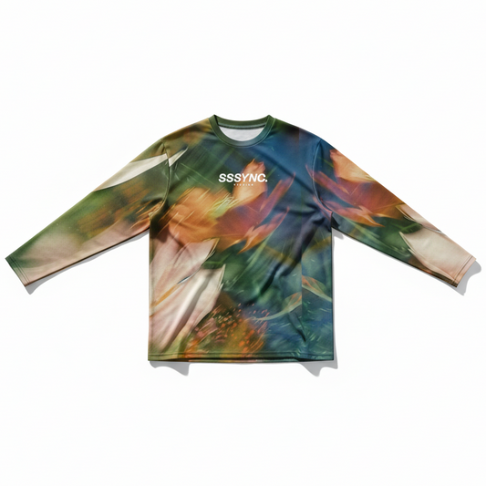 Colorful long-sleeve shirt with abstract design and 'SSSYNC' branding on a white background
