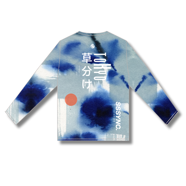 A long-sleeve children's shirt with a blue and white tie-dye pattern, featuring white Japanese characters on the back, a small orange circle graphic, and 'SSSYNC' printed vertically on the lower back, shown against a plain white background.