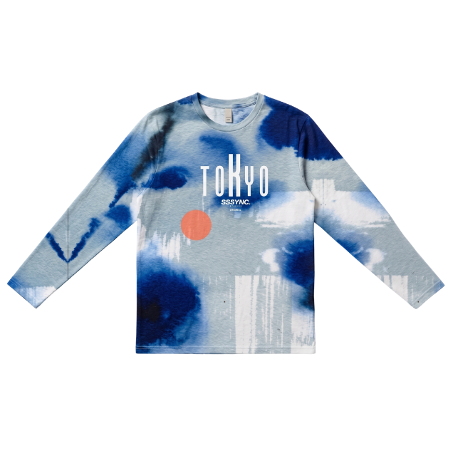 A long-sleeve crewneck shirt featuring an abstract blue and white tie-dye style pattern with a small orange circle and the text 'TOKYO SSSYNC' printed on the chest, displayed on a solid white background.