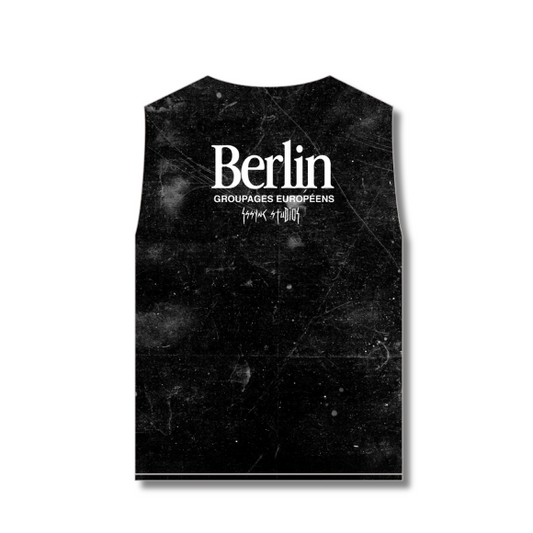 A rectangular black sleeveless patch with a distressed grunge texture, featuring the word 'Berlin' in white serif font with smaller text underneath, shown on a plain white background.